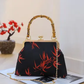 Black BAMBOO HANDLE HANDBAG with Red leaf accent